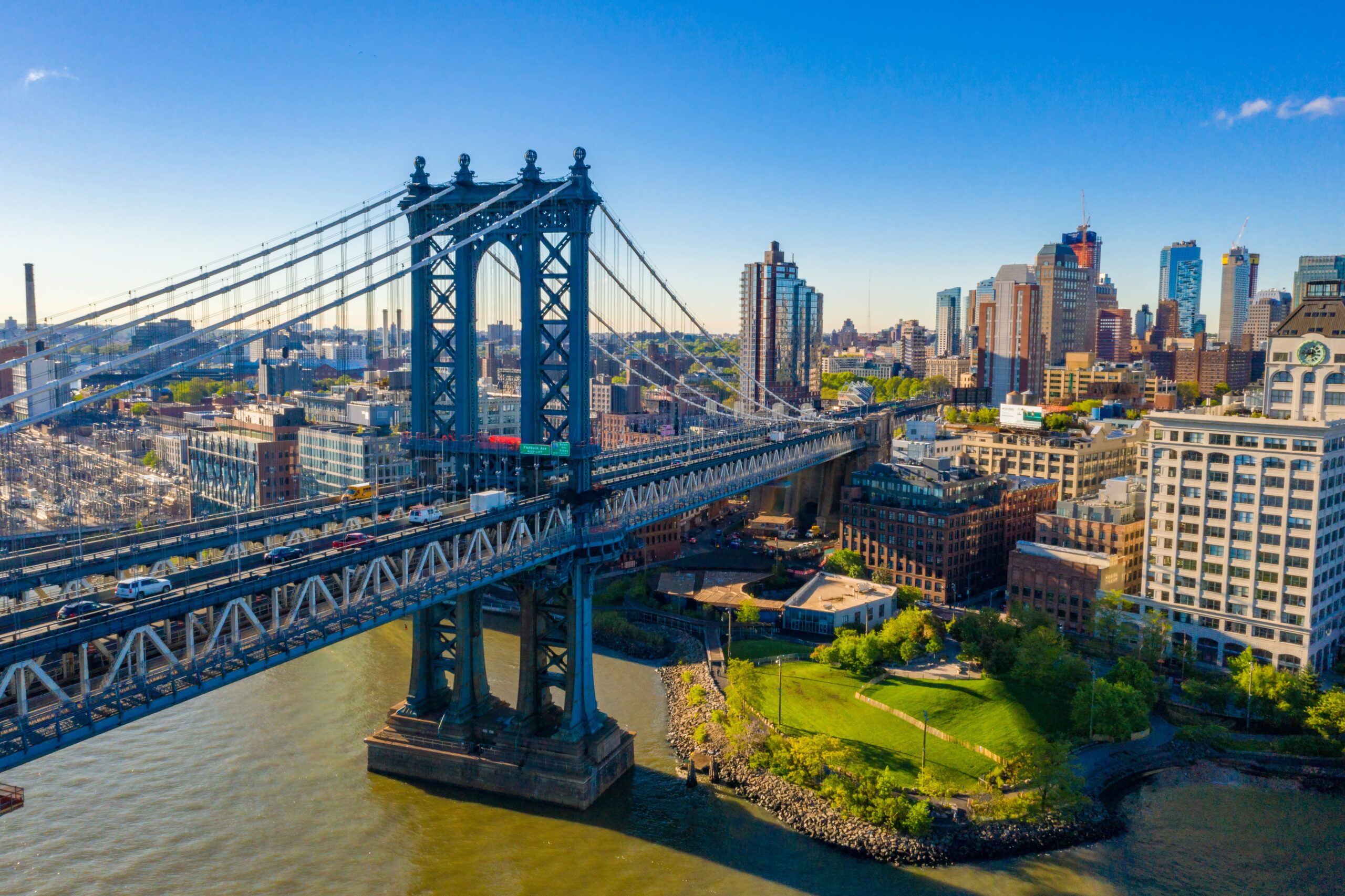 Scenic view of the Manhattan Bridge in New York City at sunset, symbolising reliable vehicle shipping across the East Coast.